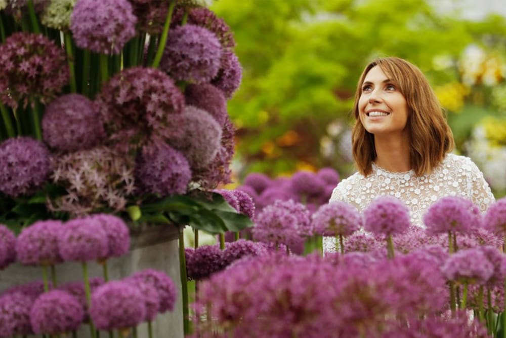 TV presenter, Alex Jones, looking at some flowers at RHS Chelsea Flower Show
