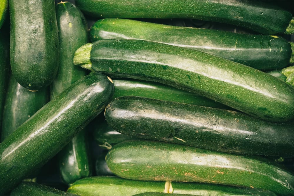 Many cut courgettes in a basket